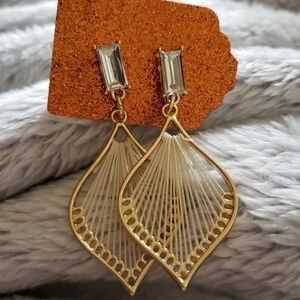 Gold and cream cubic zirconia earrings.